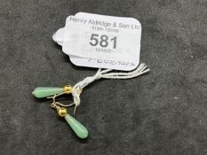 Jewellery: Yellow metal drop earrings each set with a pear shaped jade. Test as 18ct gold. Weight