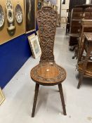 20th cent. Oak arts and crafts spinners's/weaver's chair vine leaf seat and back, chip carved legs.