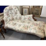 19th cent. Victorian mahogany chaise lounge upholstered in a buttoned chintz, carved scroll to the