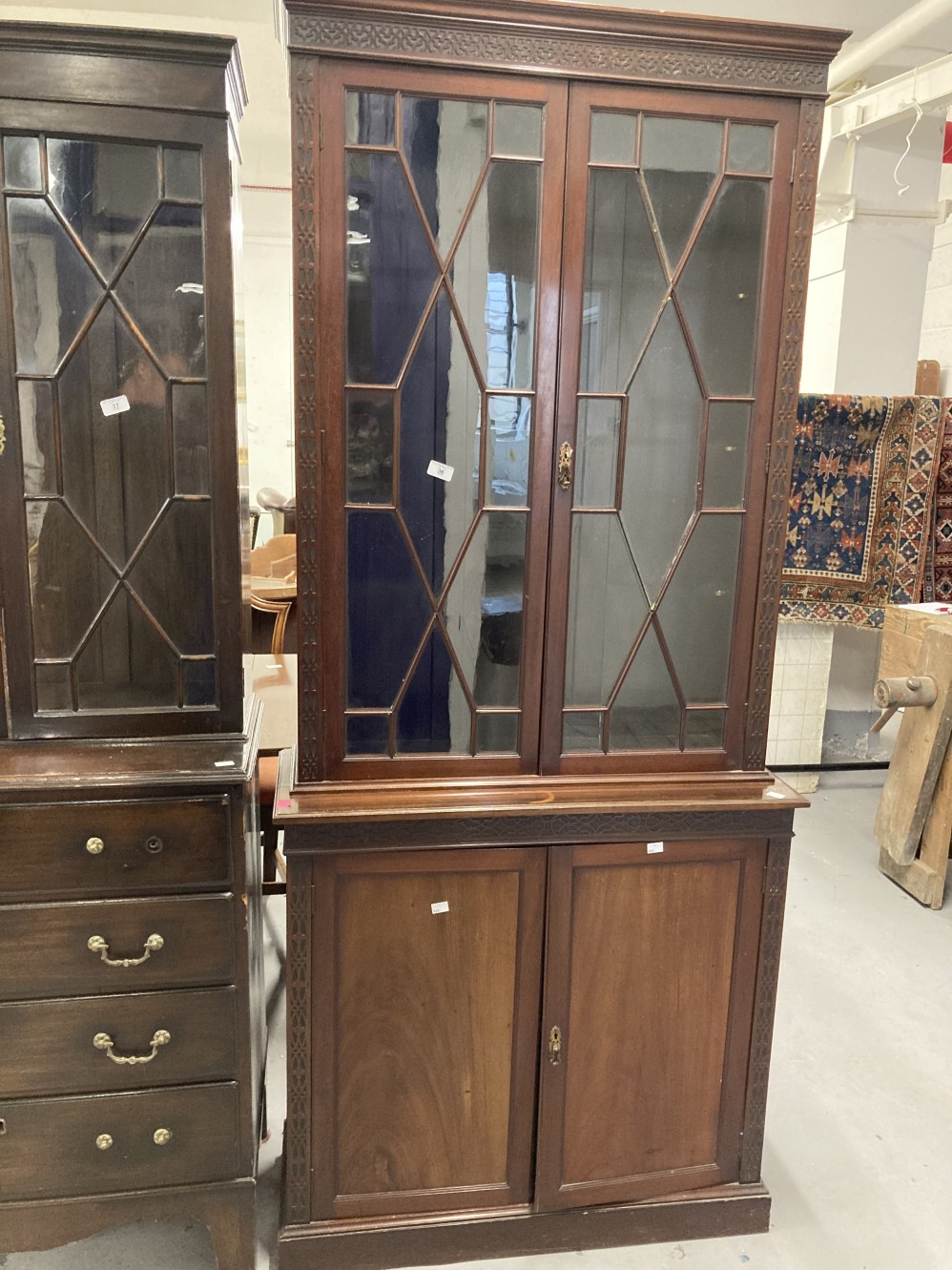 Early 20th cent. Mahogany two part bookcase, the thirteen pane glazed doors above two blind doors on