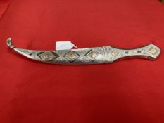 Edged Weapons: White metal Jambiya dagger with yellow metal engraved diamond shaped panels to the