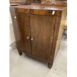 19th cent. Mahogany bow front dwarf cupboard the galleried top above two doors with cross banding,