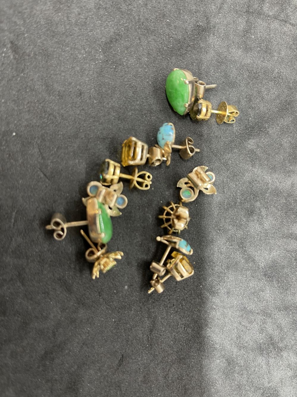 Jewellery: Yellow metal six pairs of stone set earrings, to include jade, turquoise, opal,