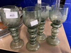 Late 19th cent. Green etched glass wine goblets with applied punts, probably German. 7½ins. (4)