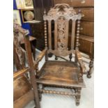 19th cent. Oak Carolean style elbow chair, carved back and seat, barley twist and carved supports.