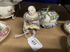 Early 20th cent. German porcelain figural inkwell, Chinese boy reading a book dressed in a white