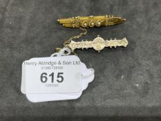 Hallmarked Gold Jewellery: 15ct bar brooch decorated with three seed pearls and wreaths, Chester