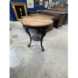 Early 20th cent. Cast iron pub table with later wooden top. 23ins. x 28ins.