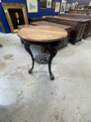 Early 20th cent. Cast iron pub table with later wooden top. 23ins. x 28ins.