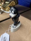 20th cent. Ceramics: Felix the cat kept on walking, on whit ceramic base. 4ins.