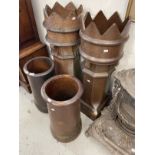 Late 19th cent. Glazed pottery chimney pots, a pair of crown top pots and two others.