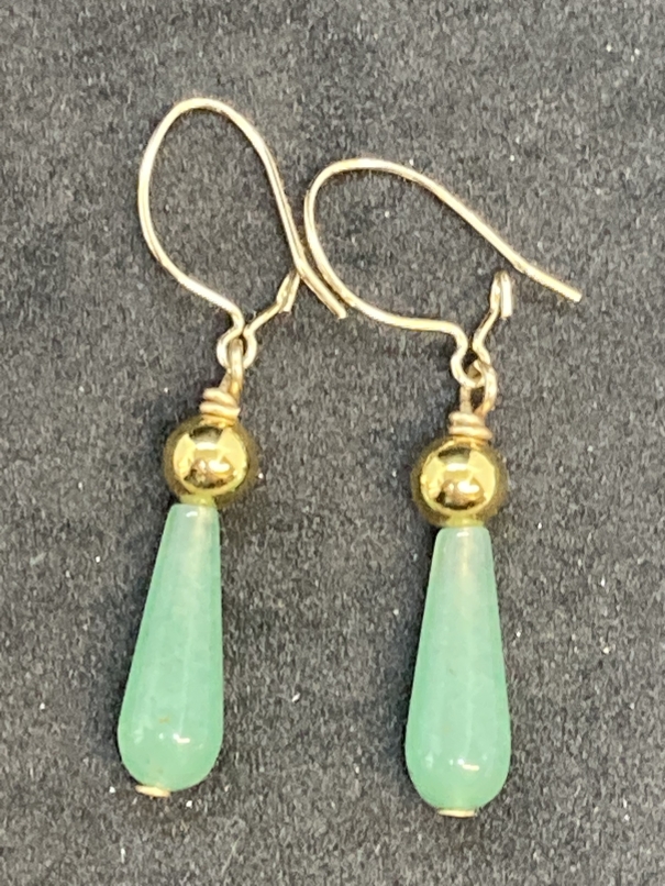 Jewellery: Yellow metal drop earrings each set with a pear shaped jade. Test as 18ct gold. Weight