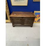 18th cent. Small oak six panel coffer, carved floral decoration to front two panels on bracket