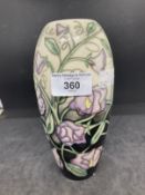 20th cent. Ceramics: Moorcroft slim ovoid shaped vase in the Sweet Pea pattern on black and ivory