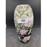 20th cent. Ceramics: Moorcroft slim ovoid shaped vase in the Sweet Pea pattern on black and ivory