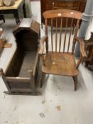 19th cent. Carved oak cradle shaped hood above carved rockers and a Windsor chair.