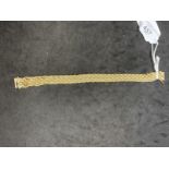 18ct yellow gold fancy link bracelet. Weight 25.8g.