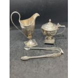 Hallmarked Silver: Helmet jug, honey pot, sugar nips, mixed dates and hallmarks. Total weight 12.