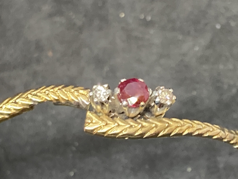 Hallmarked Jewellery: 9ct gold bangle set with a circular cut ruby, estimated weight 0.10ct, with - Image 2 of 3