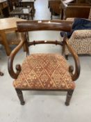William IV 19th cent. Mahogany armchair with C scrolled arms on turned front supports and sabre
