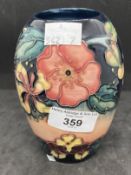 20th cent. Ceramics: Moorcroft ovoid shaped vase in the Honeysuckle pattern on pink and blue ground,