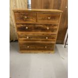 20th cent. Pitch pine two over three chest of drawers on plinth support. 44ins. x 19ins. x 49ins.