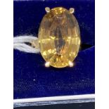 18ct gold ring set with an oval cut golden topaz, estimated weight of 9.00ct. Weight 8.2g.