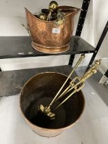 Metalware: Large copper log bucket and helmet scuttle, plus brass fire irons-tongs, shovel, poker