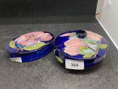 Moorcroft 'Magnolia' pattern boxes each decorated with blossoming magnolias on a blue ground,