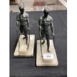 20th cent. Spelter bookends each with a bronze finish, figure of an athlete on an alabaster base.