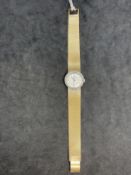 Watches: Ladies 18ct yellow gold Omega bracelet watch with diamond set bezel. 40g. Inclusive