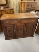 Early 20th cent. Hardwood cupboard with two drawers above a central panel flanked by two doors all