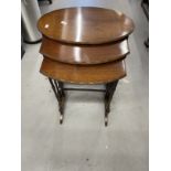 19th cent. Mahogany nest of three tables of delicate form, turned supports below oval tops with