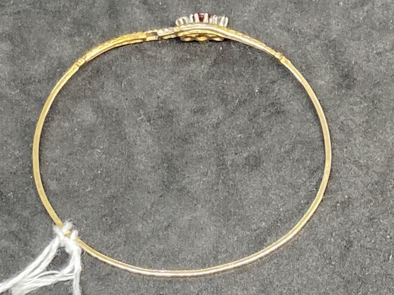 Hallmarked Jewellery: 9ct gold bangle set with a circular cut ruby, estimated weight 0.10ct, with - Image 3 of 3