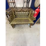 20th cent. Wrought iron garden bench honeycomb shaped back, scrolled arms and legs. Depth 18ins.