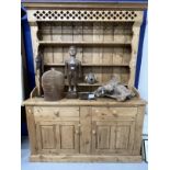 Early 20th cent. Continental pine dresser two single drawers over two cupboards with fretwork