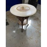 Early 20th cent. Cast iron pub table with rams heads with a round inlaid marble top with rampant
