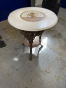 Early 20th cent. Cast iron pub table with rams heads with a round inlaid marble top with rampant