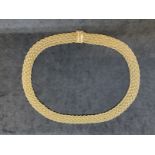 18ct yellow gold fancy link necklet. Weight 54.8g.