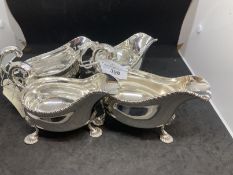 Hallmarked Silver: Two pairs of sauce boats on shell feet C scroll handle and gadroon border.