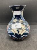 20th cent. Ceramics: Moorcroft rare white floral design on dark blue ground, appears to be a second.