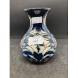 20th cent. Ceramics: Moorcroft rare white floral design on dark blue ground, appears to be a second.