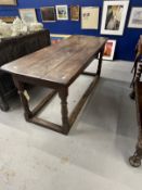 18th cent. Oak refectory table the three plank top above turned legs with a tied stretcher.