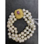 Bracelet triple row of sixty 7.5mm cultured pearls, twenty pearls per row with space bars having