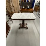 Early 19th cent. Rosewood marble topped side table on a turned column platform base on bun feet.