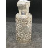 Hallmarked Silver: Cologne bottle, Birmingham 1890 with elaborate repoussage case, hinged lid, the