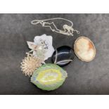 Jewellery: White metal four brooches plus a pendant set with an oval onyx attached to a curb link