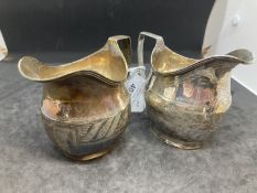 Hallmarked Silver: Two Georgian cream jugs, same shape different decoration, both Hallmarked London.