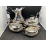 Hallmarked silver four-piece tea set comprising hot water jug, teapot, milk jug and sucre all with