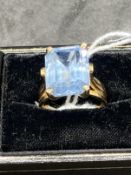 18ct gold ring set with a rectangular blue topaz, estimated weight 8.00ct. Weight 8.3g.